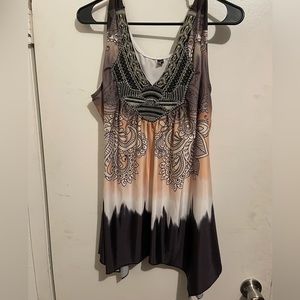 Fashions plus size top in 4X.  Multi-color with beaded detail in front.